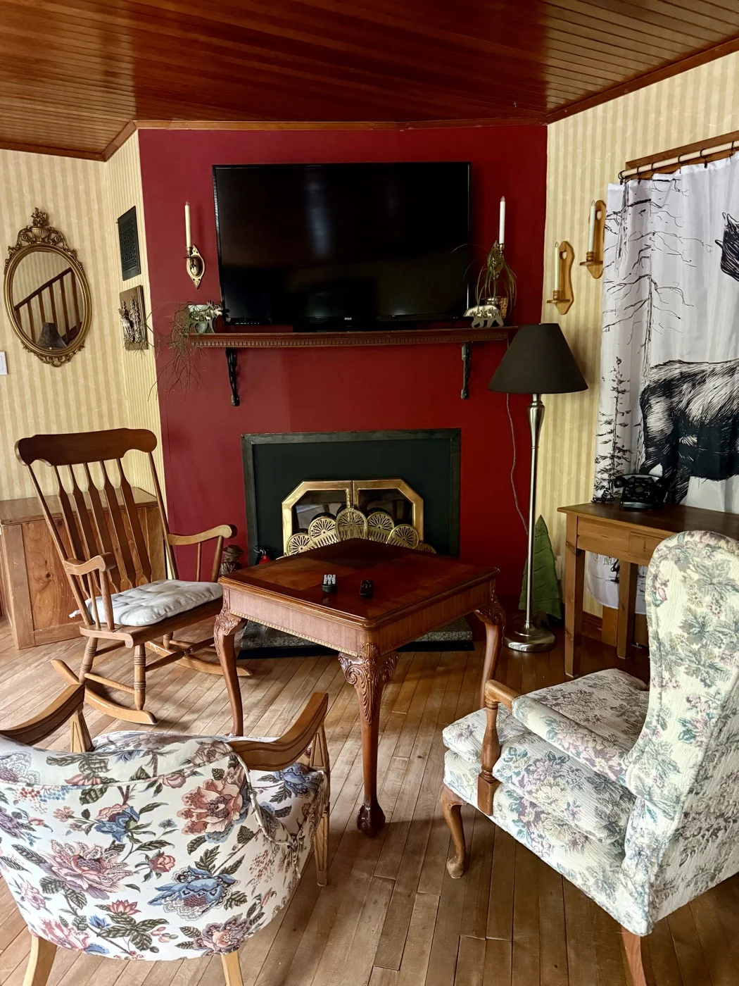 Common room sitting area with fireplace and TV