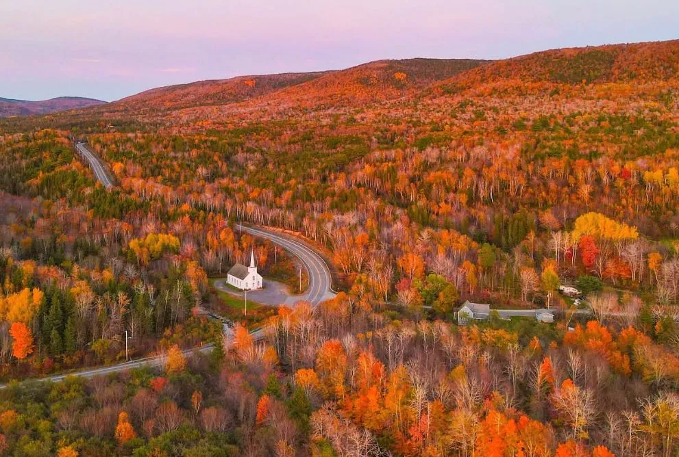 The Cabot Trail curving through Cape Breton's fall-coloured highlands